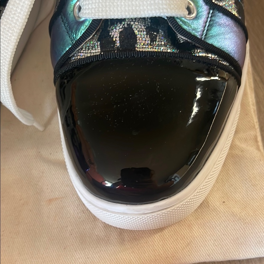 Black & Purple Women's Sneakers
made in Paris by Christian LOUBOUTIN
Red bottom - Picture 10 of 16